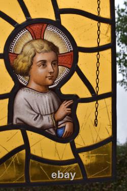 Antique religious stained glass window panel young jesus portrait