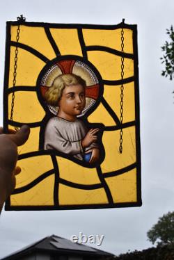 Antique religious stained glass window panel young jesus portrait