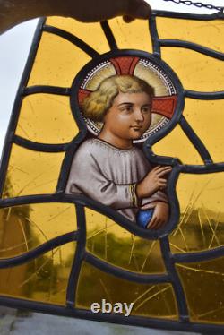 Antique religious stained glass window panel young jesus portrait