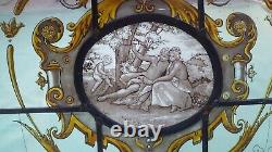 Beautiful old Stained/Painted Glass Panel depicting a courting couple and Cupid