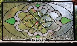 Exquisite Victorian-style stained glass panel, meticulously crafted with iridesc