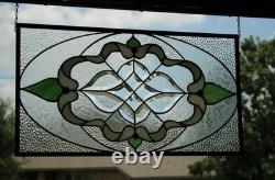 Exquisite Victorian-style stained glass panel, meticulously crafted with iridesc