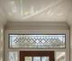 Extra-long clear beveled stained glass panel transom sidelight, measuring 48.75