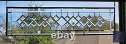 Extra-long clear beveled stained glass panel transom sidelight, measuring 48.75