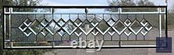 Extra-long clear beveled stained glass panel transom sidelight, measuring 48.75
