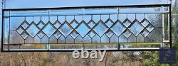 Extra-long clear beveled stained glass panel transom sidelight, measuring 48.75