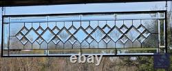 Extra-long clear beveled stained glass panel transom sidelight, measuring 48.75