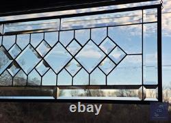 Extra-long clear beveled stained glass panel transom sidelight, measuring 48.75