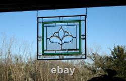 Hanging stained glass window panel with beveled edges, obscure textured glass