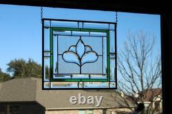 Hanging stained glass window panel with beveled edges, obscure textured glass