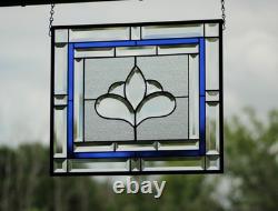 Hanging stained glass window panel with beveled edges, obscure textured glass