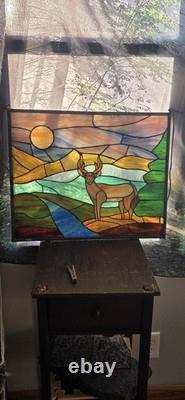 Stained glass panel featuring a buck in a landscape setting, Tiffany Style