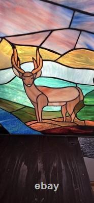 Stained glass panel featuring a buck in a landscape setting, Tiffany Style