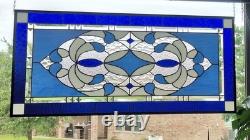 Stained glass panel featuring a cobalt blue contemporary star, 40.75x18.75