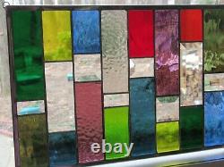 Stained glass panel with bevels and rainbow colors