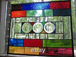 Stained glass panel with clear glass bevels and rainbow colors