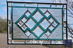 Teal green stained glass window panel with beveled, hanging 23 1/2x 15 5/8