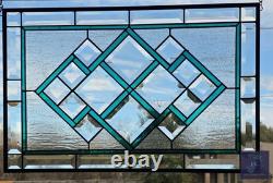 Teal green stained glass window panel with beveled, hanging 23 1/2x 15 5/8